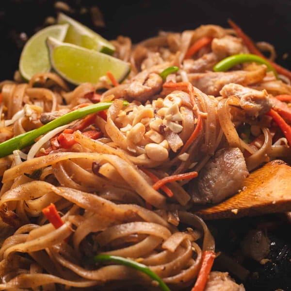 Sogo Hibachi and Sushi Lounge's Japanese noodles with chicken, vegetables, peanuts, and lime wedges.