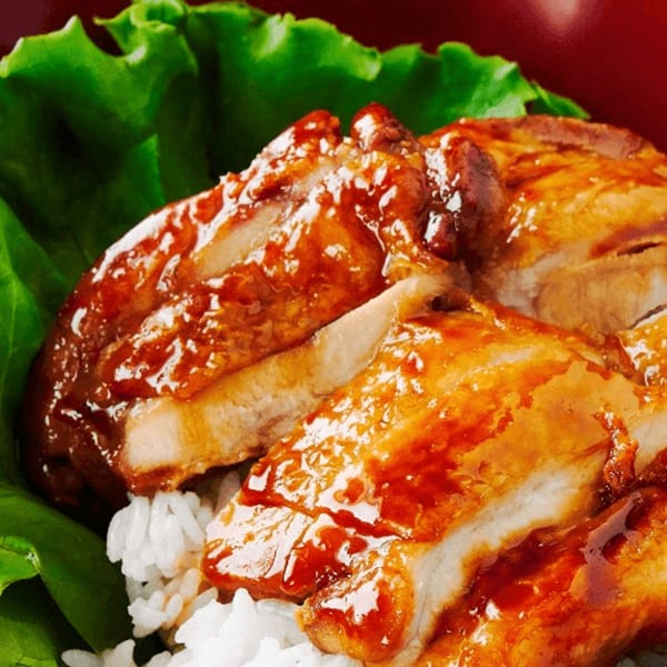 Sogo Hibachi and Sushi Lounge's teriyaki chicken with white rice and green lettuce.